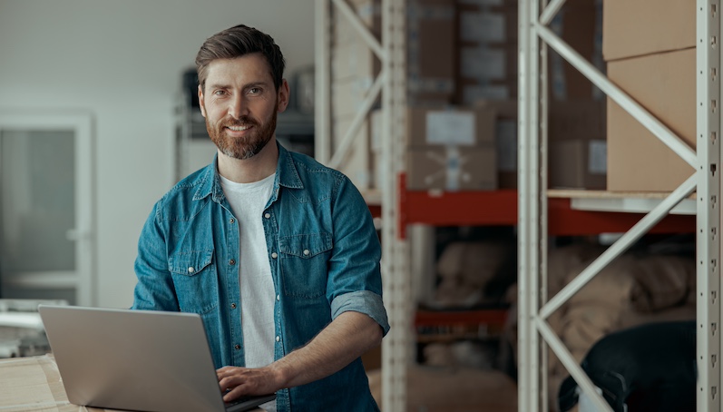 small business owner reading about commercial flood insurance