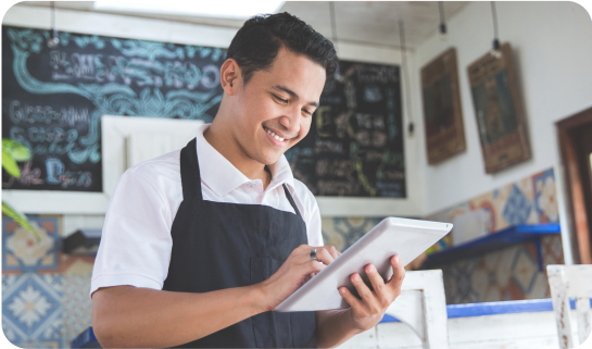 shop owner looking at tablet device