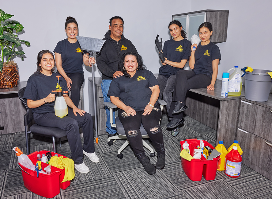 family of cleaners gathered with their supplies